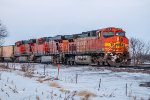 BNSF 5713 GE AC44CW and BNSF 5926 GE ES44AC and sister unit work a westbound empty hopper train